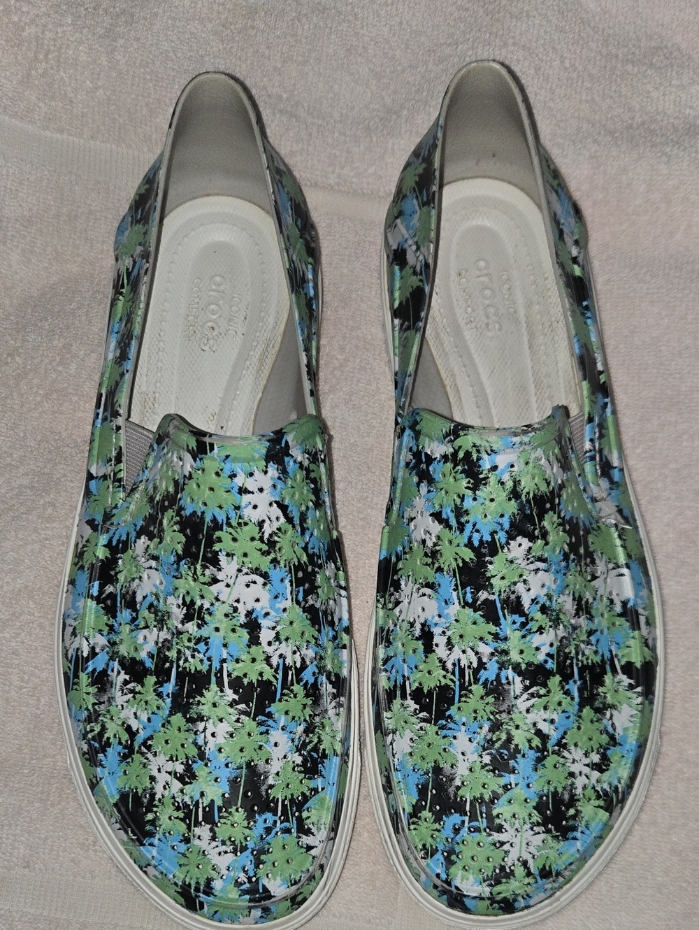 CROCS Women’s Slip-On Floral Pattern Flats — Black, Green, Blue